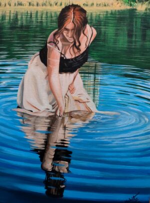 Woman in a white & black dress standing in water